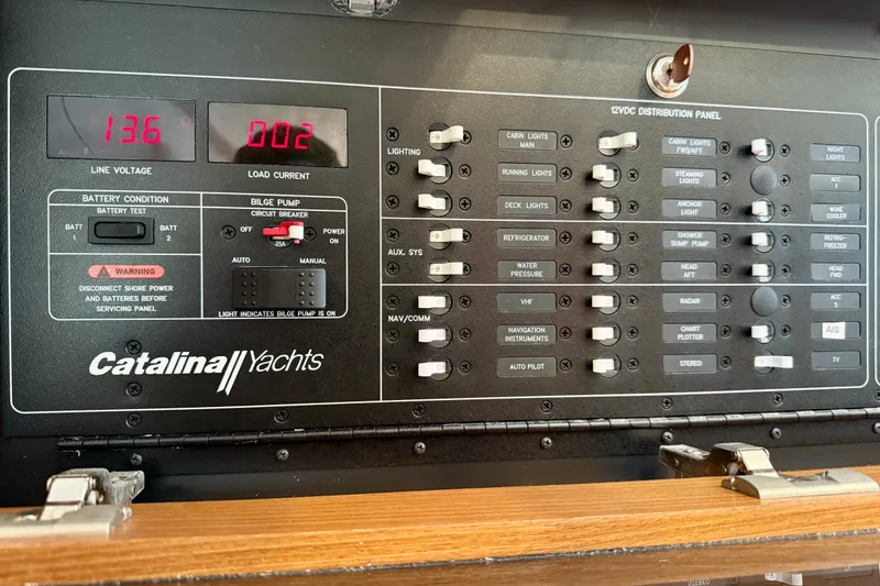 Slide: The Image of Catalina 425 yacht electrical panel with switches and voltage display, 2020 model. - 59