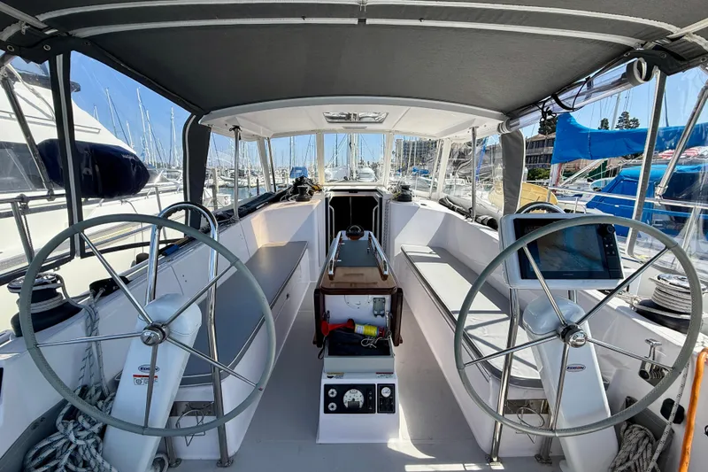 Slide: The Image of Cockpit of 2020 Catalina 425 sailboat with dual steering wheels and navigation equipment. - 6