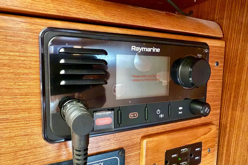 Slide: The Image of Raymarine marine radio system on 2020 Catalina 425 yacht, featuring control knobs and display. - 61