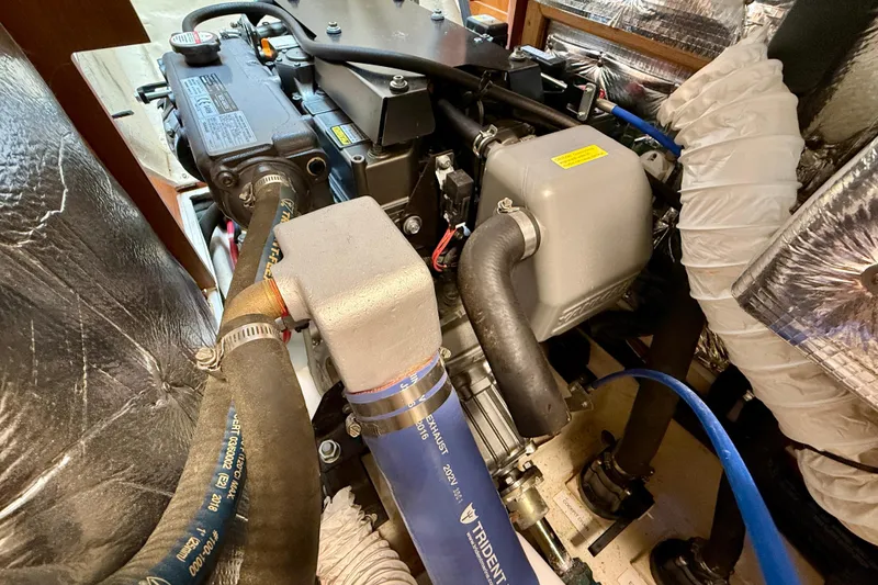 Slide: The Image of Engine compartment of a 2020 Catalina 425 sailboat, showcasing detailed mechanical components. - 66
