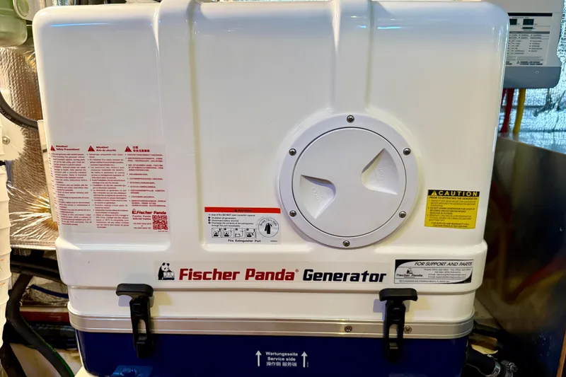 Slide: The Image of Fischer Panda generator on a 2020 Catalina 425 yacht, featuring safety instructions and caution labels. - 69
