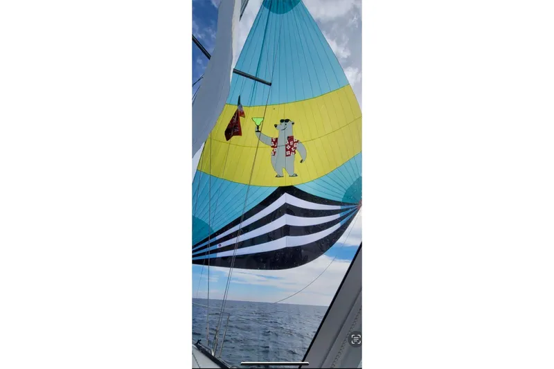 Slide: The Image of 2020 Catalina 425 sailboat on calm ocean under clear blue sky. - 81