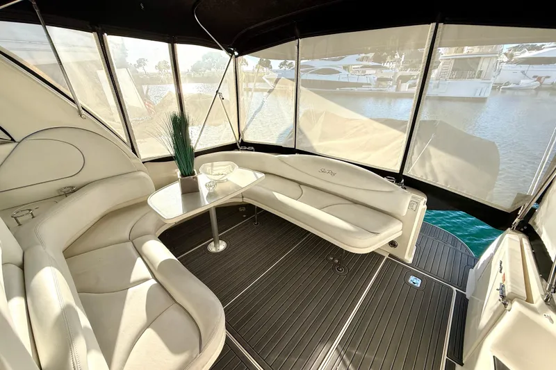 Slide: The Image of Luxurious interior of 2003 Sea Ray 380 Sundancer yacht with elegant seating and table. - 10