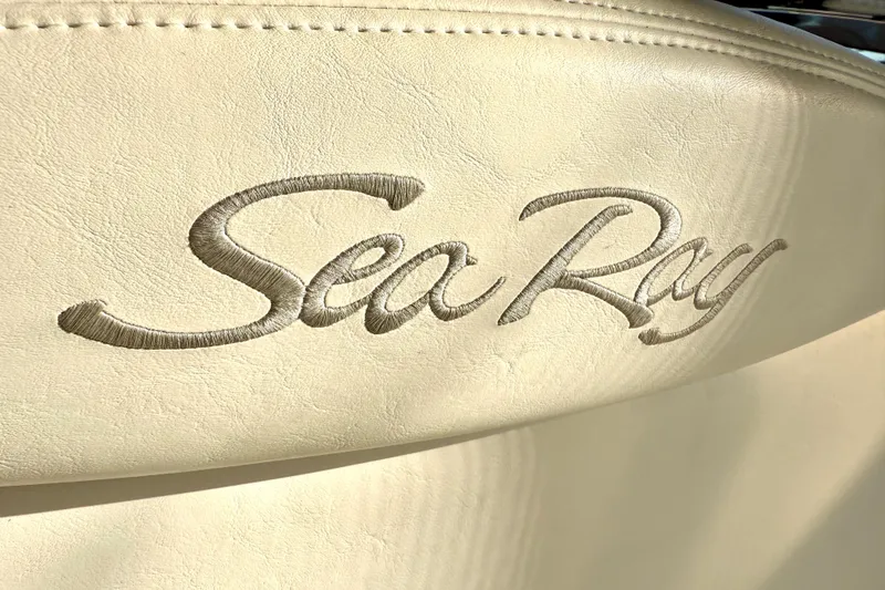 Slide: The Image of Sea Ray logo embroidered on beige leather seat, 2003 Sea Ray 380 Sundancer. - 12