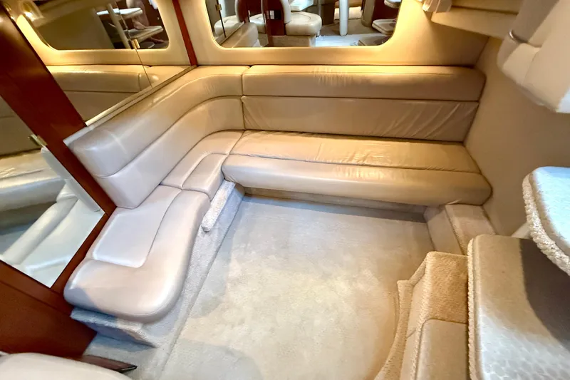 Slide: The Image of Luxurious interior of 2003 Sea Ray 380 Sundancer with beige leather seating. - 18