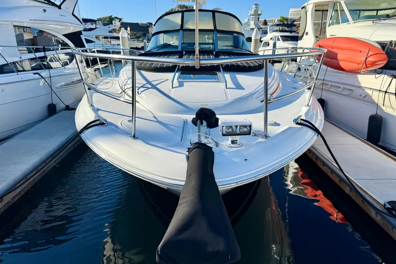 Slide: The Image of 2003 Sea Ray 380 Sundancer yacht docked at marina, front view. - 2