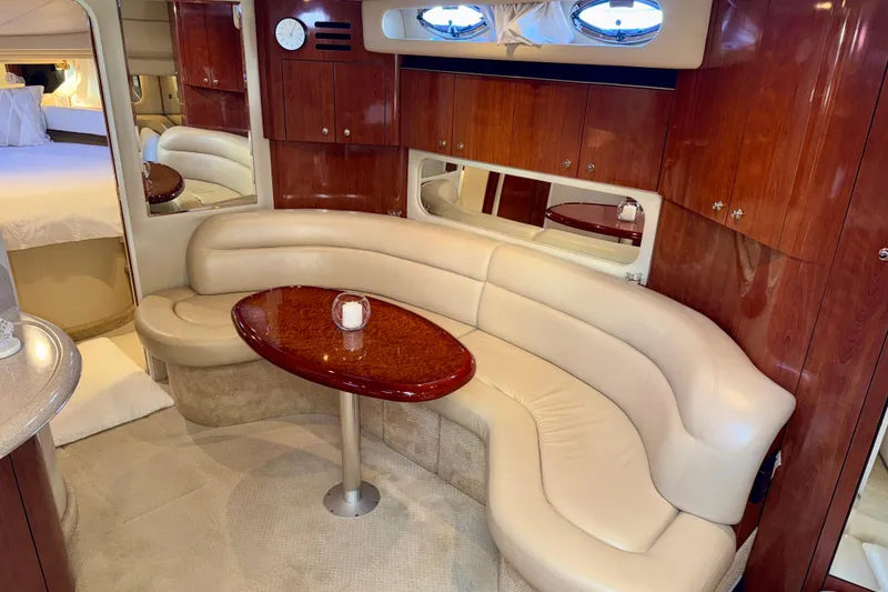 Slide: The Image of Luxurious interior of 2003 Sea Ray 380 Sundancer yacht with plush seating and elegant wood finishes. - 25
