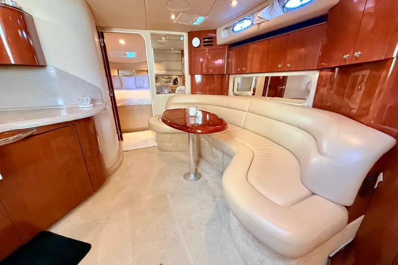 Slide: The Image of Luxurious interior of 2003 Sea Ray 380 Sundancer yacht with elegant seating and wood finishes. - 26