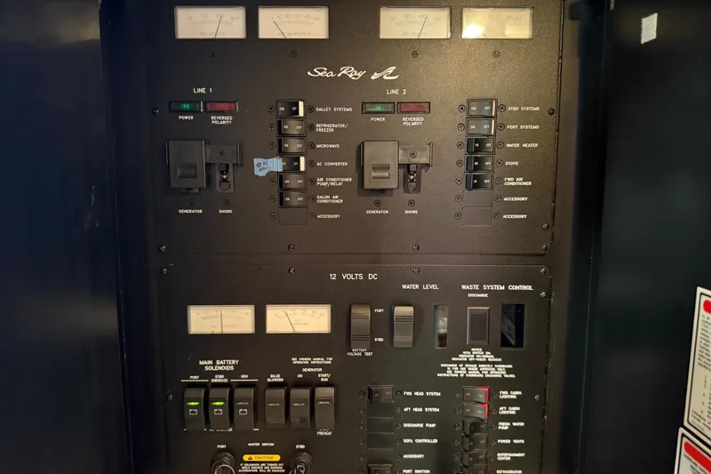 Slide: The Image of Electrical control panel of a 2003 Sea Ray 380 Sundancer boat. - 32