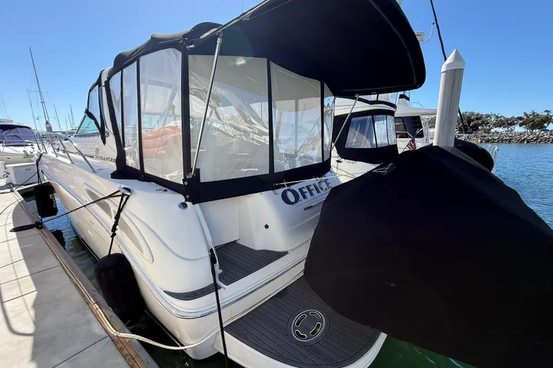 Slide: The Image of 2003 Sea Ray 380 Sundancer docked at marina under clear blue sky. - 4
