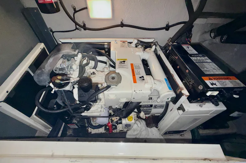 Slide: The Image of Engine compartment of a 2003 Sea Ray 380 Sundancer with Kohler power system. - 40