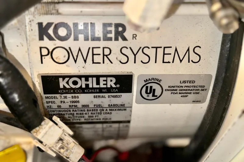 Slide: The Image of Kohler marine generator label on 2003 Sea Ray 380 Sundancer, model 7.3E-BBG, gasoline-powered. - 41