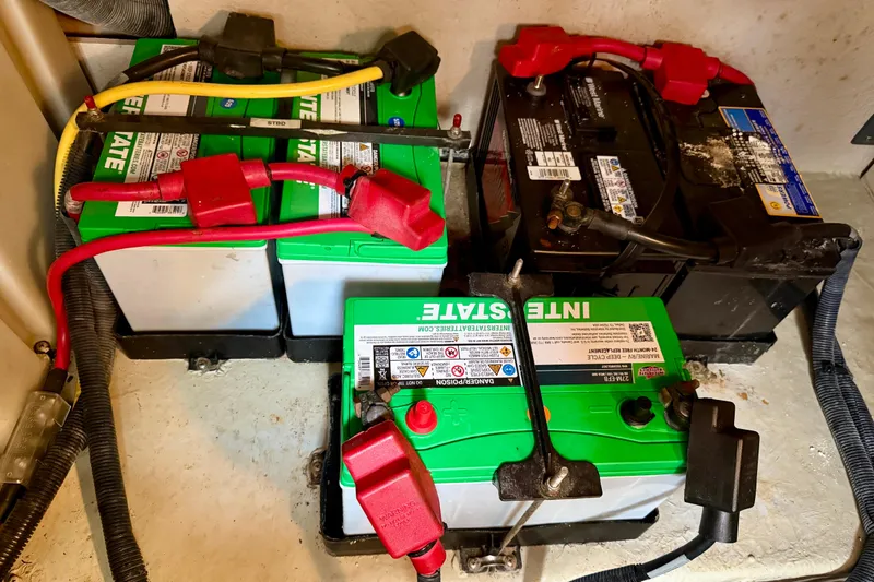 Slide: The Image of Engine compartment of a 2003 Sea Ray 380 Sundancer, showcasing mechanical components and hoses. - 43