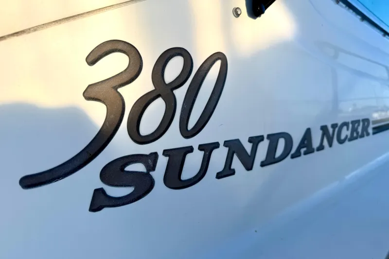 Slide: The Image of Close-up of 2003 Sea Ray 380 Sundancer logo on boat hull. - 7
