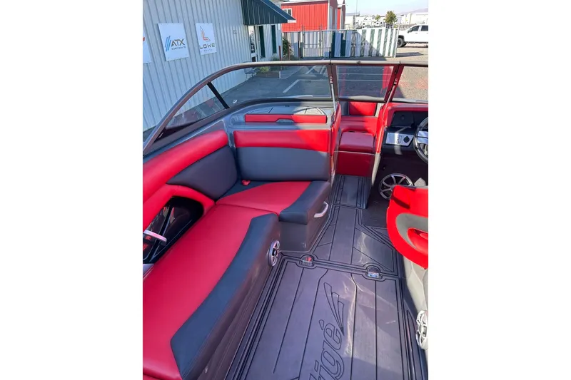 Slide: The Image of 2018 Tigé R20 boat interior with red and black seating, modern design. - 22