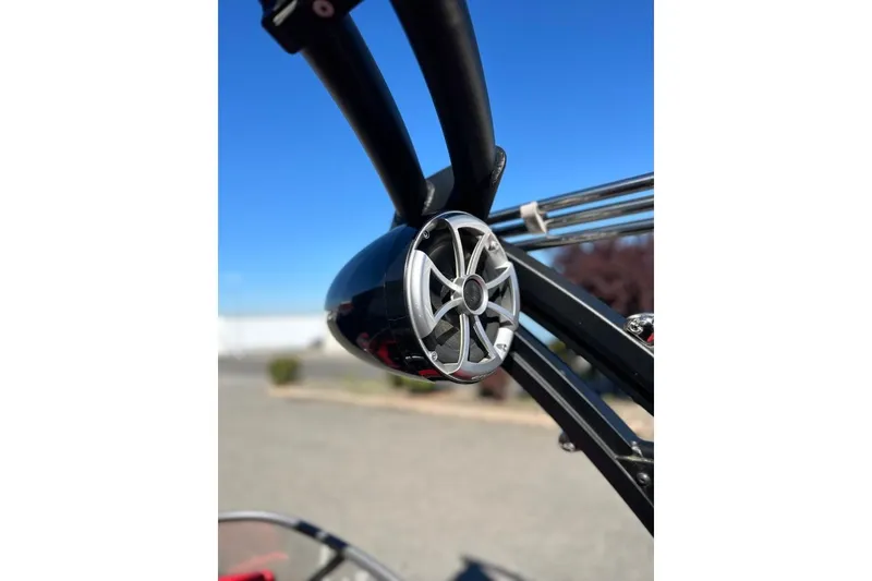 Slide: The Image of Close-up of a 2018 Tigé R20 boat speaker against a clear blue sky. - 35