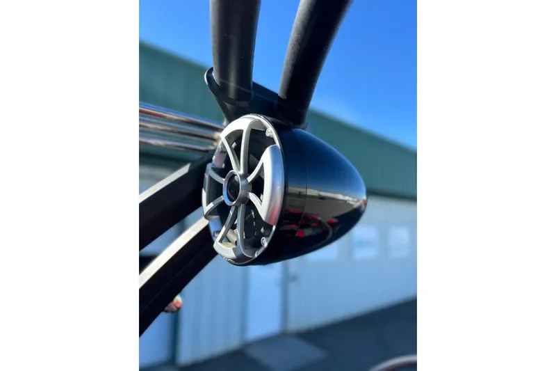 Slide: The Image of Close-up of a 2018 Tigé R20 boat speaker against a clear blue sky. - 36