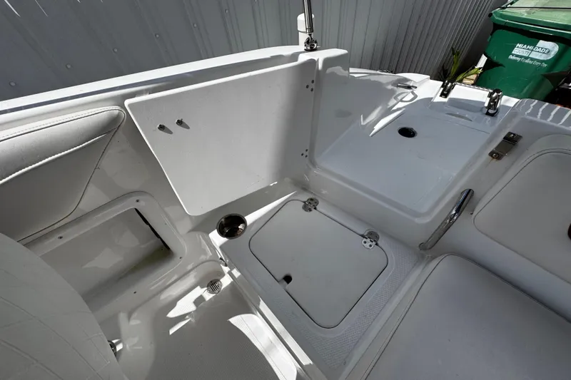 Slide: The Image of 2017 Tahoe 2150 boat interior with storage compartments and seating area. - 10