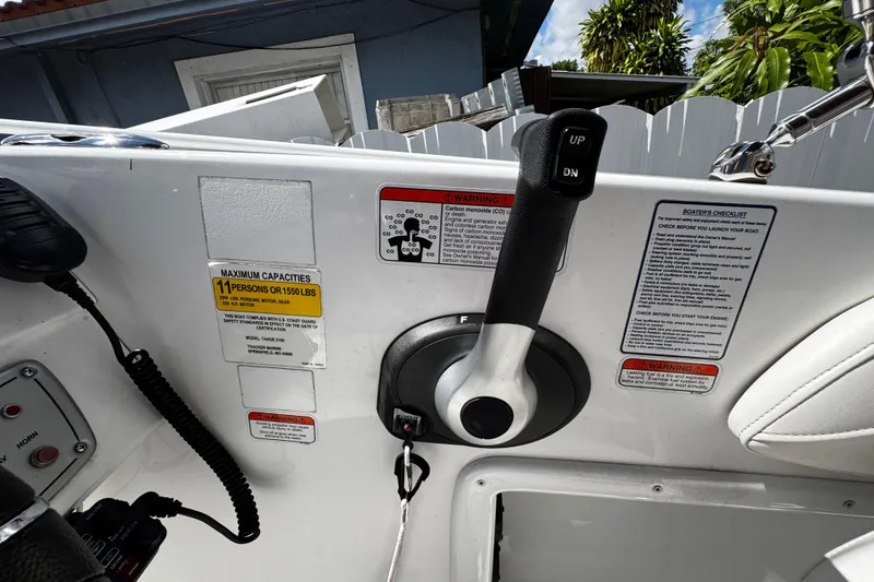 Slide: The Image of 2017 Tahoe 2150 boat control panel with throttle and safety warnings. - 16