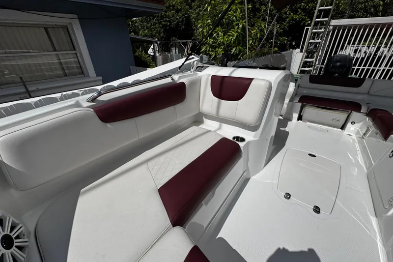 Slide: The Image of 2017 Tahoe 2150 boat interior with white and maroon seating, spacious layout. - 33