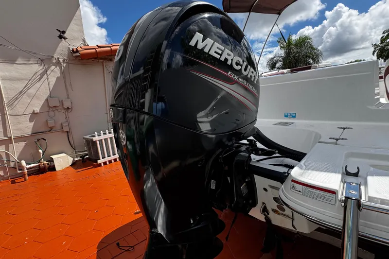 Slide: The Image of 2017 Tahoe 2150 boat with Mercury FourStroke outboard motor on a sunny day. - 38