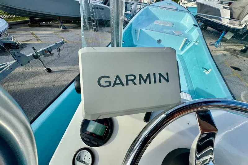 Slide: The Image of 2024 Panga 25 CC boat dashboard with Garmin navigation system. - 12