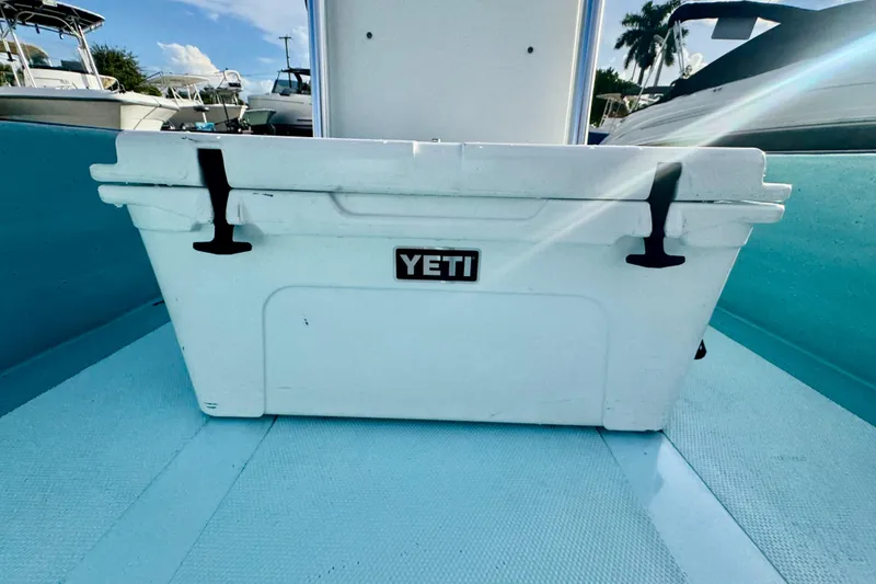 Slide: The Image of 2024 Panga 25 CC boat with a Yeti cooler on deck. - 20
