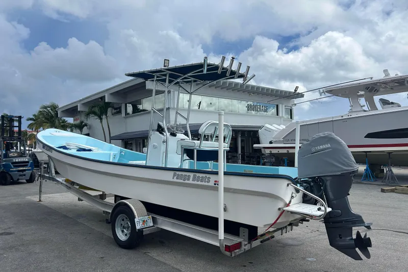 Slide: The Image of 2024 Panga IMEMSA 25 CC boat on trailer, parked outside a brokerage building. - 30