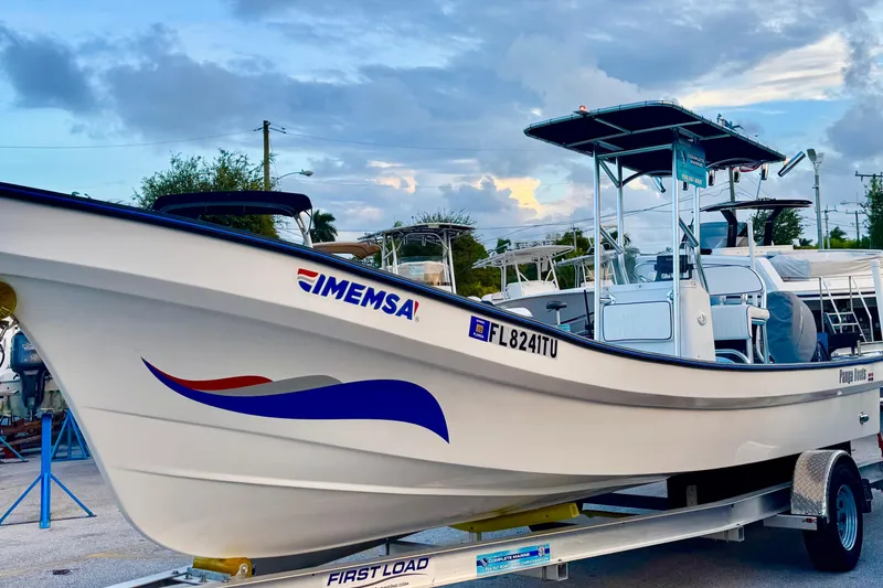 Slide: The Image of 2024 Panga IMEMSA 25 CC boat on trailer, under a cloudy sky. - 31
