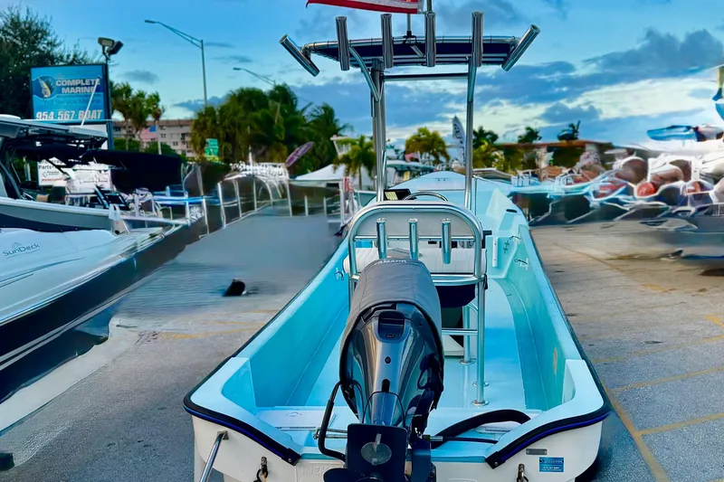 Slide: The Image of 2024 Panga 25 CC boat displayed at a marina with a clear sky backdrop. - 33