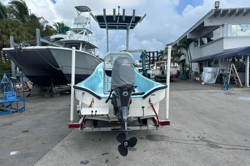 Slide: The Image of 2024 Panga IMEMSA 25 CC boat with Yamaha outboard motor in a marina setting. - 35