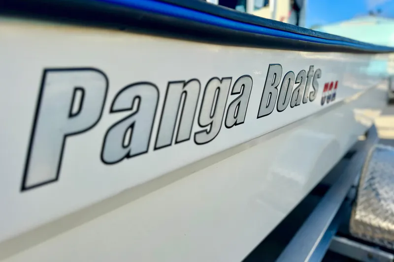 Slide: The Image of 2024 Panga 25 CC boat with logo on the side, close-up view. - 44