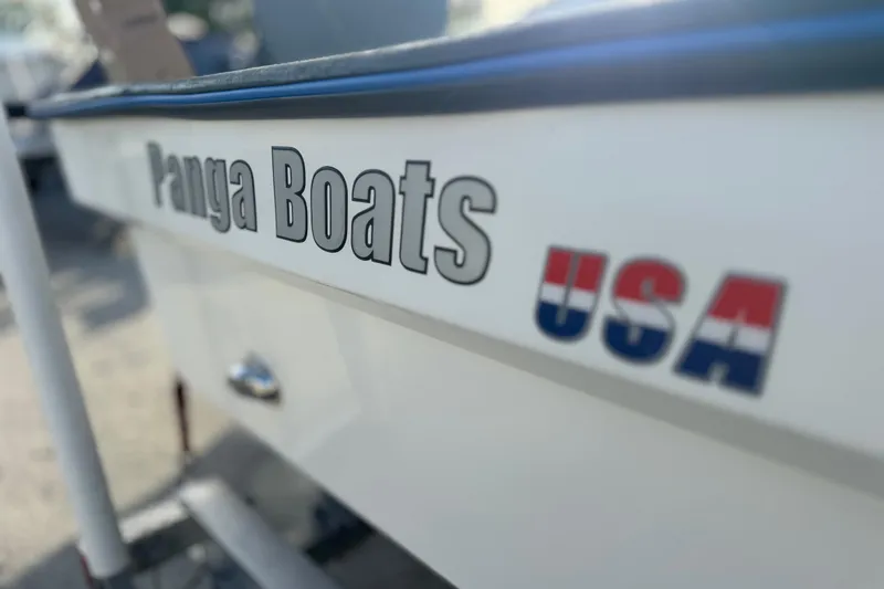 Slide: The Image of 2024 Panga 25 CC boat with "Panga Boats USA" branding on the side. - 45