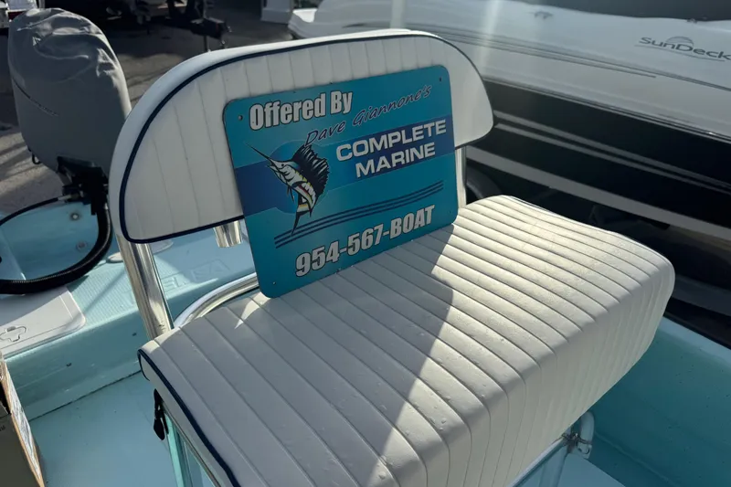 Slide: The Image of 2024 Panga 25 CC boat seat with Complete Marine sign and contact number. - 9