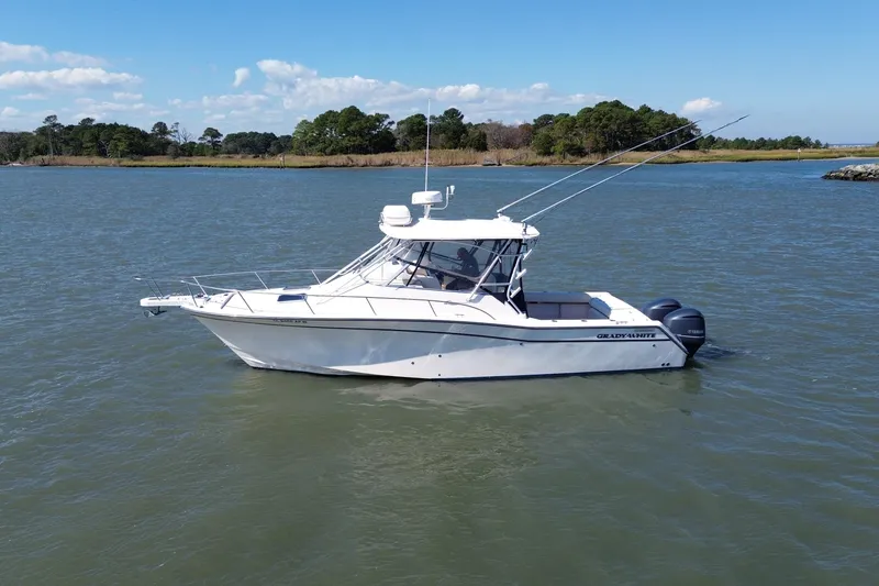 The Image of 2005 Grady-White Express 330 boat on calm water with scenic background. - 0