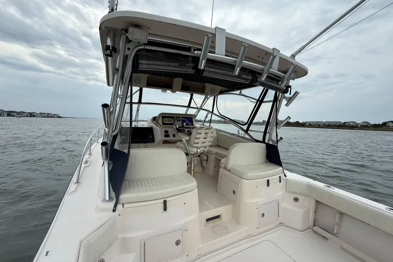Slide: The Image of 2005 Grady-White Express 330 boat interior with helm, seats, and ocean view. - 10