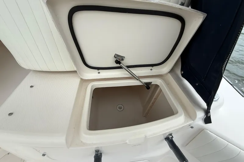 Slide: The Image of Open storage compartment on a 2005 Grady-White Express 330 boat. - 14