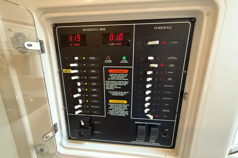 Slide: The Image of Electrical control panel on a 2005 Grady-White Express 330 boat. - 34