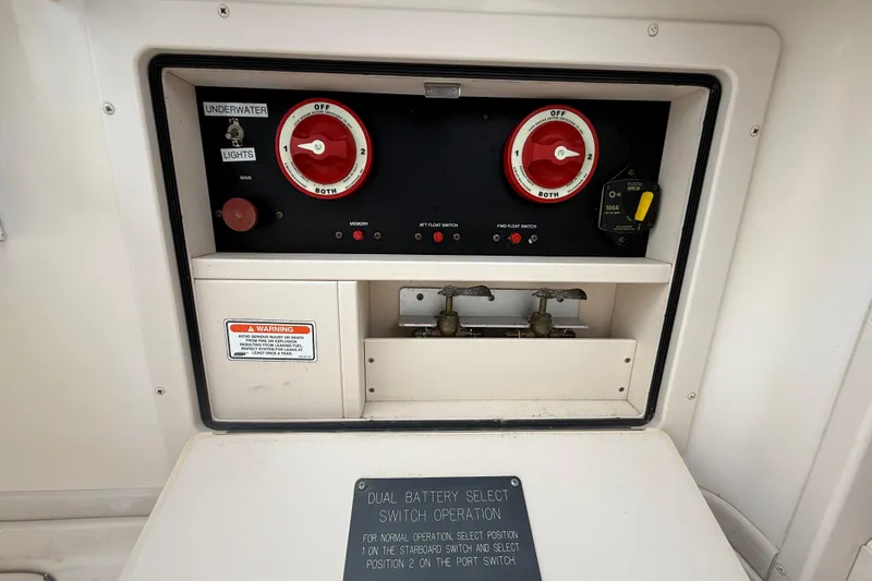 Slide: The Image of Control panel of a 2005 Grady-White Express 330 boat with dual battery switches. - 35
