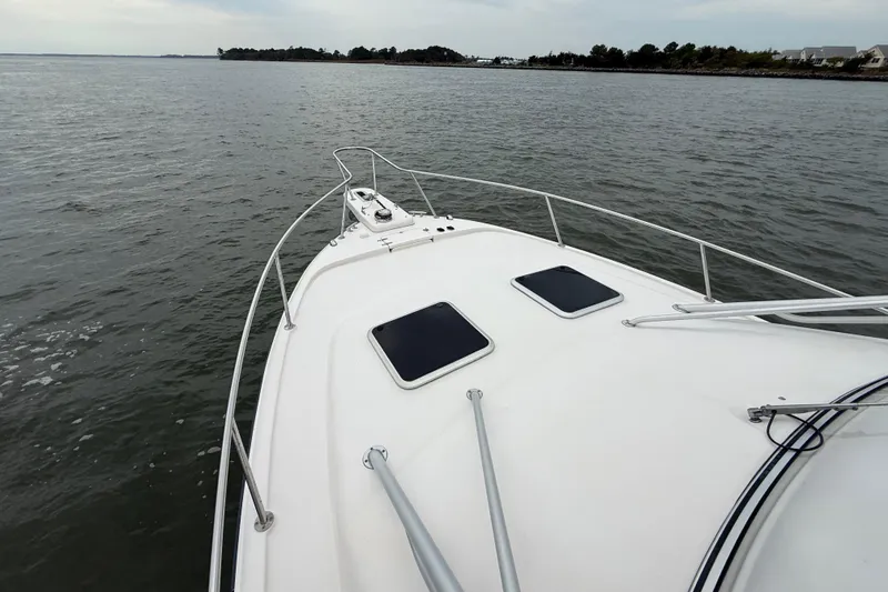 Slide: The Image of 2005 Grady-White Express 330 boat on calm waters, view from the bow. - 36