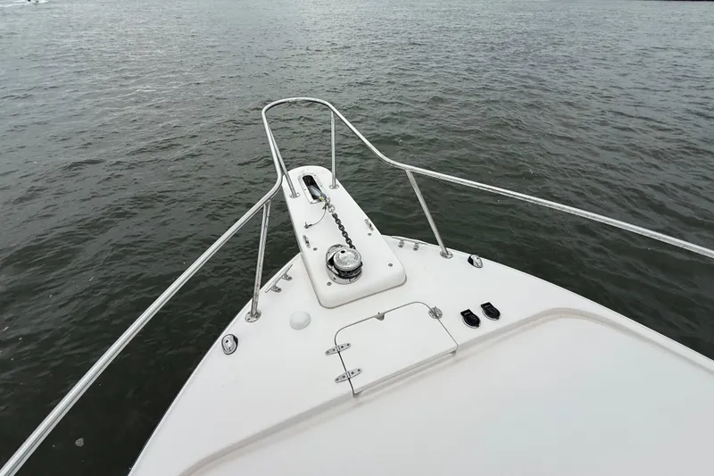 Slide: The Image of Bow view of 2005 Grady-White Express 330 on calm water. - 37