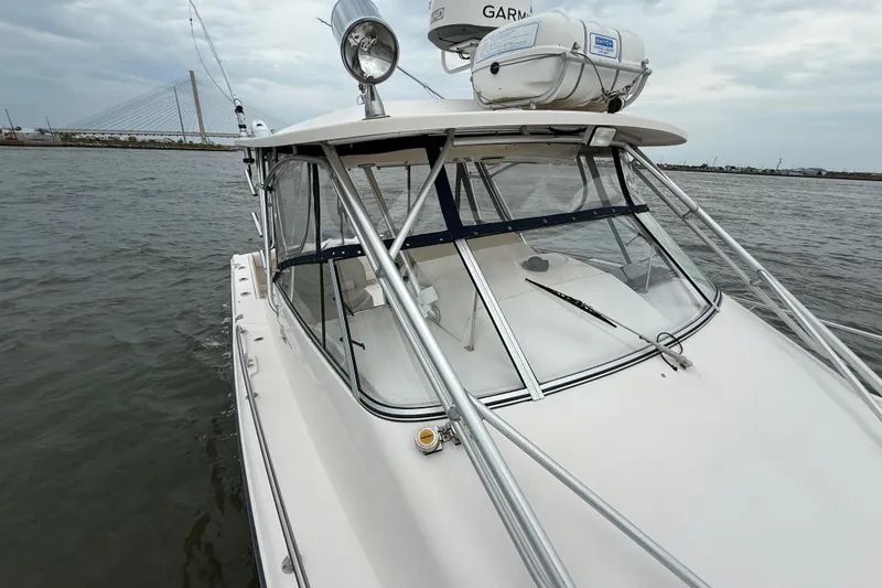 Slide: The Image of 2005 Grady-White Express 330 boat on water, featuring sleek design and sturdy construction. - 40