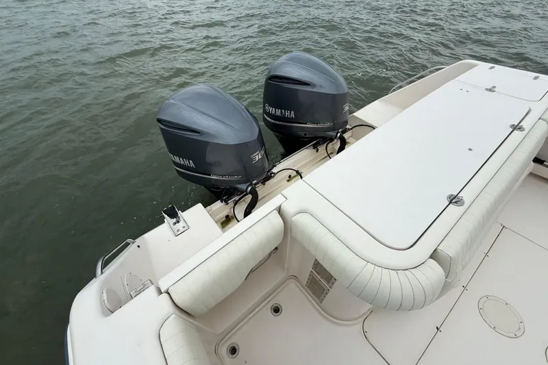 Slide: The Image of 2005 Grady-White Express 330 boat with twin Yamaha outboard engines on water. - 5