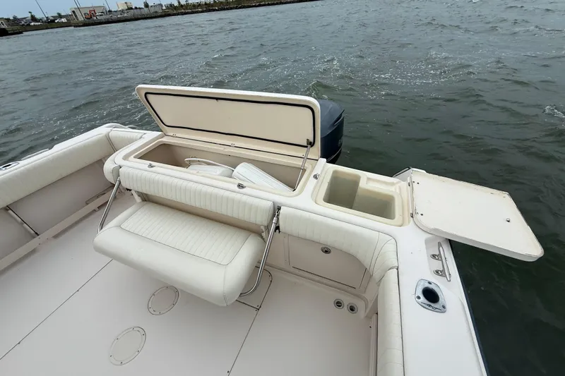 Slide: The Image of 2005 Grady-White Express 330 boat with open storage compartments on deck. - 8