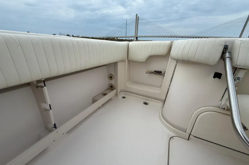Slide: The Image of 2005 Grady-White Express 330 boat interior with cushioned seating and railing. - 9