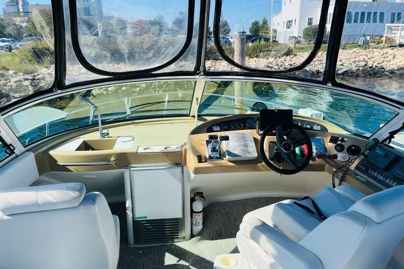 Slide: The Image of Interior view of 2001 Carver 350 Mariner boat cockpit with steering wheel and controls. - 18