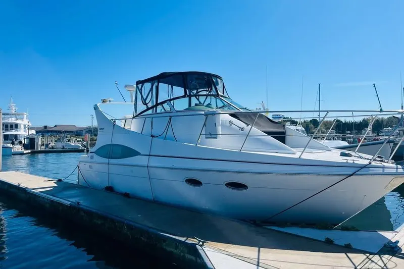Slide: The Image of 2001 Carver 350 Mariner yacht docked at marina under clear blue sky. - 19