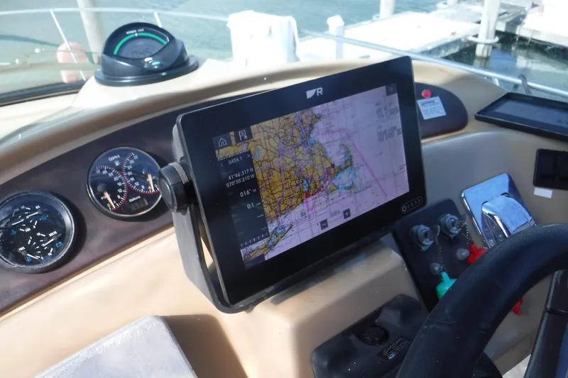 Slide: The Image of Navigation dashboard of a 2001 Carver 350 Mariner boat with GPS and gauges. - 6