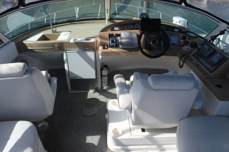 Slide: The Image of 2001 Carver 350 Mariner helm with steering wheel, controls, and seating. - 7