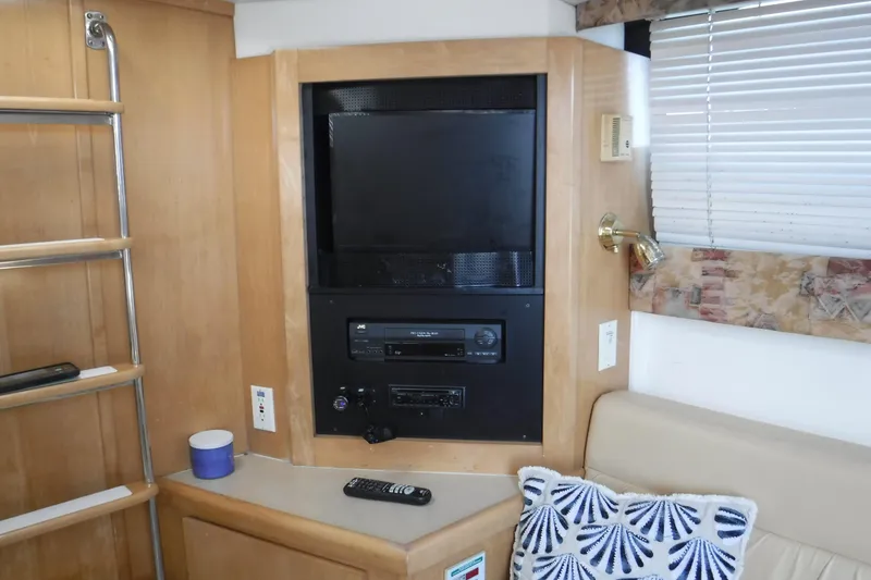 Slide: The Image of Interior of 2001 Carver 350 Mariner with TV, stereo, and cozy seating area. - 9